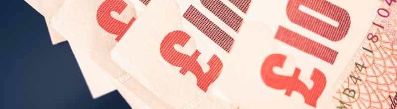 Ten British Pound Banknotes Closeup Photo. British Economy Business Concept. Ten British Pound Banknotes Closeup Photo. British Economy Business Concept.