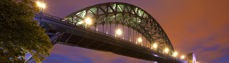 The Tyne Bridge over the river Tyne in Newcastle, England at night. The Tyne Bridge over the river Tyne in Newcastle, England at night.