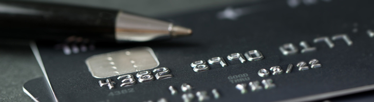 Stack of credit cards with a pen